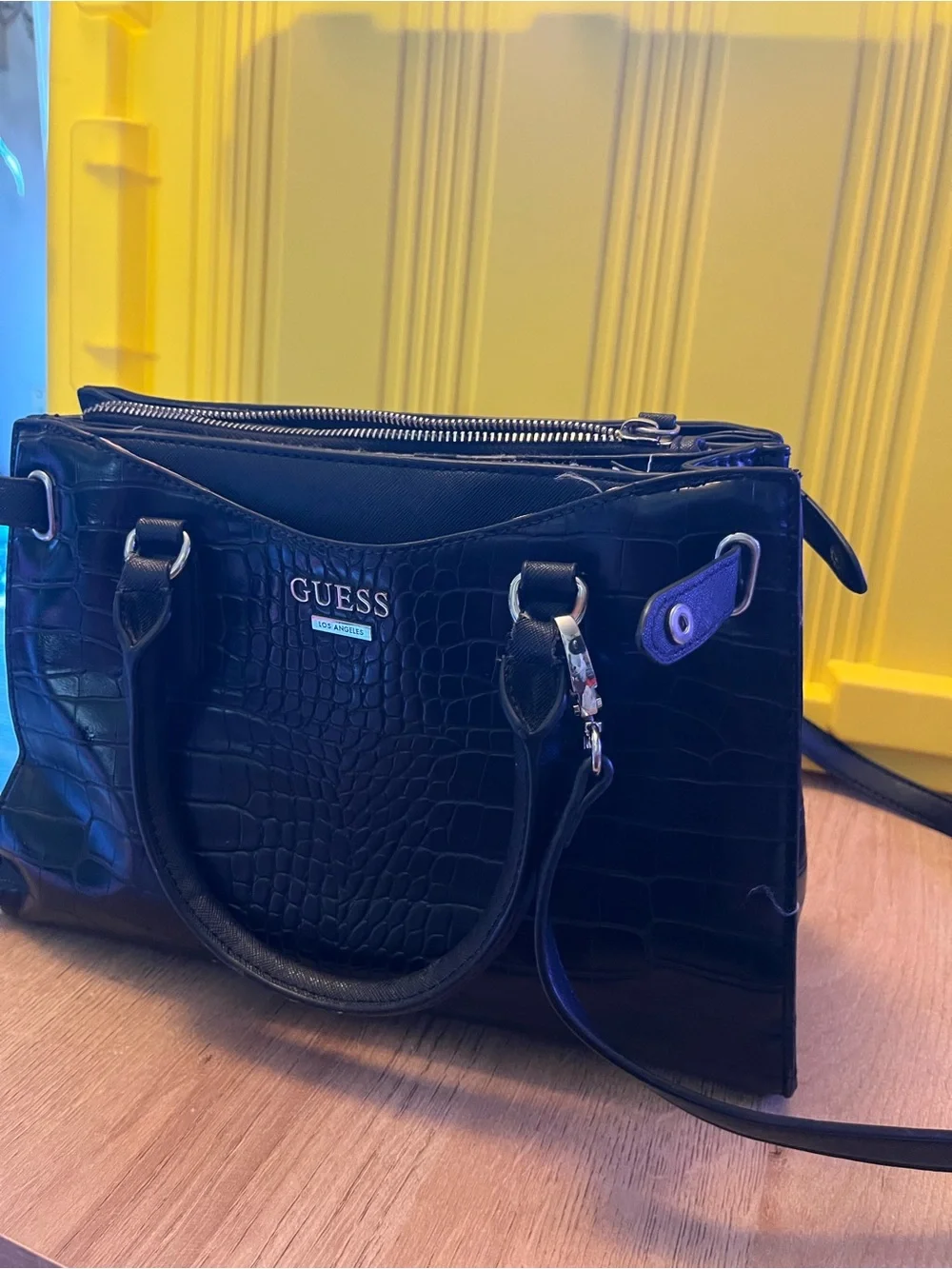 Guess Black Embossed Satchel Bag in good condition except missing one button